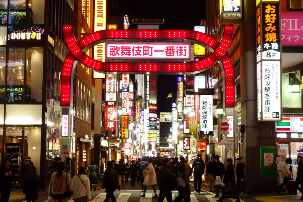 Shinjuku and Kabukicho night skyline with neon-lit streets