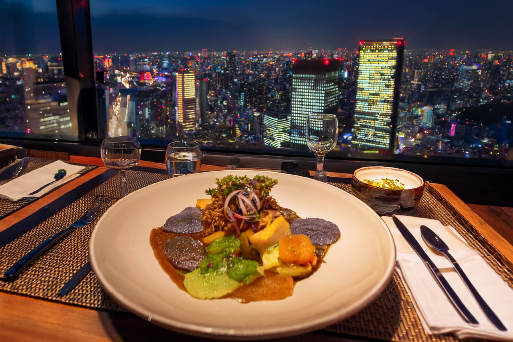 Night view from a high-floor restaurant in Roppongi with a fine dining dinner setting