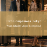 Luxury Roppongi hotel side table at night with two hotel keycards and two bottled waters, symbolizing pre-arrival state for a two-companion FFM outcall booking