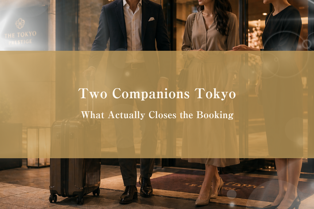 Luxury Roppongi hotel side table at night with two hotel keycards and two bottled waters, symbolizing pre-arrival state for a two-companion FFM outcall booking