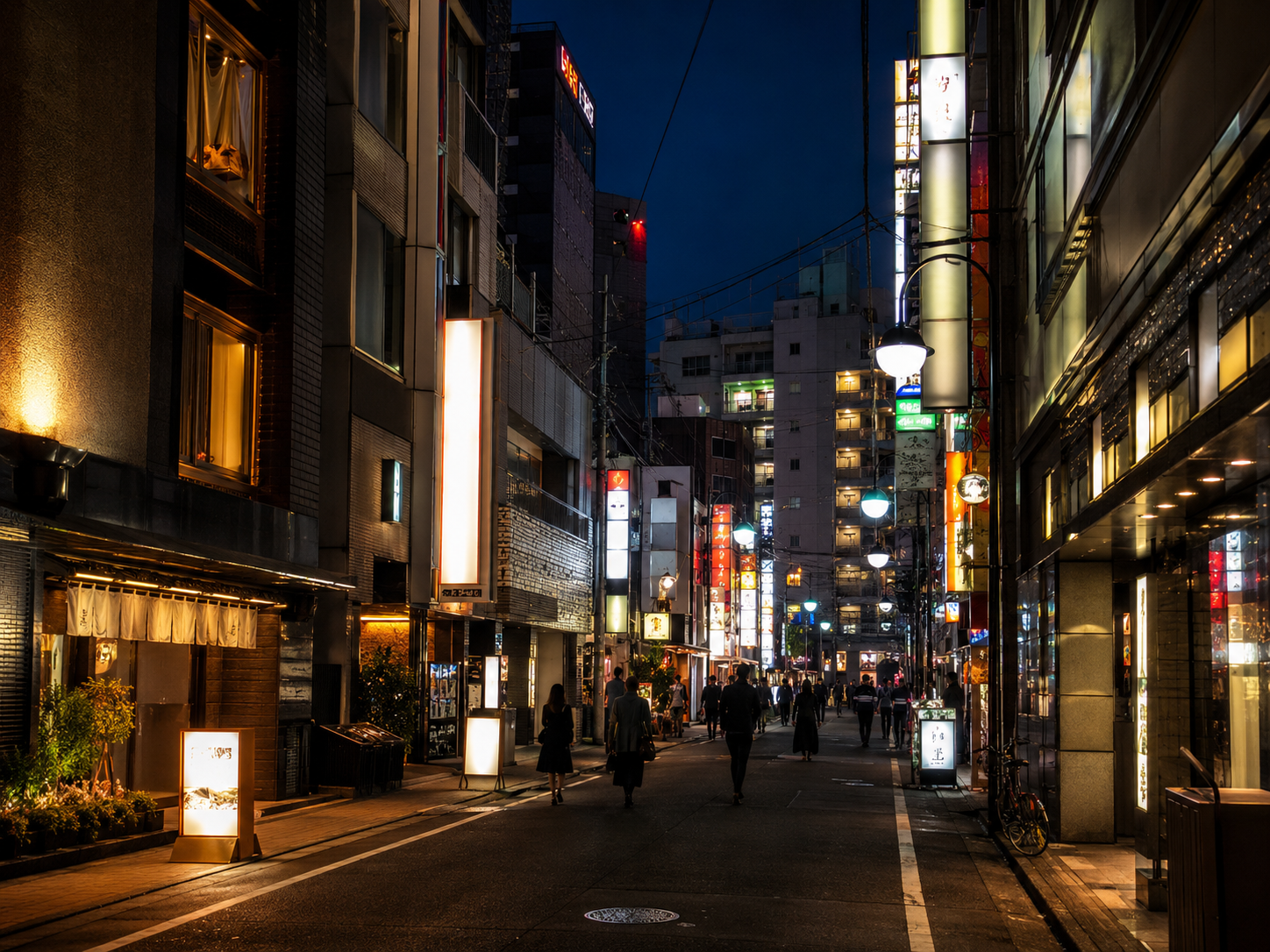 Ikebukuro Tokyo night streetscape near love-hotel district—busy urban corridor editorial photo
