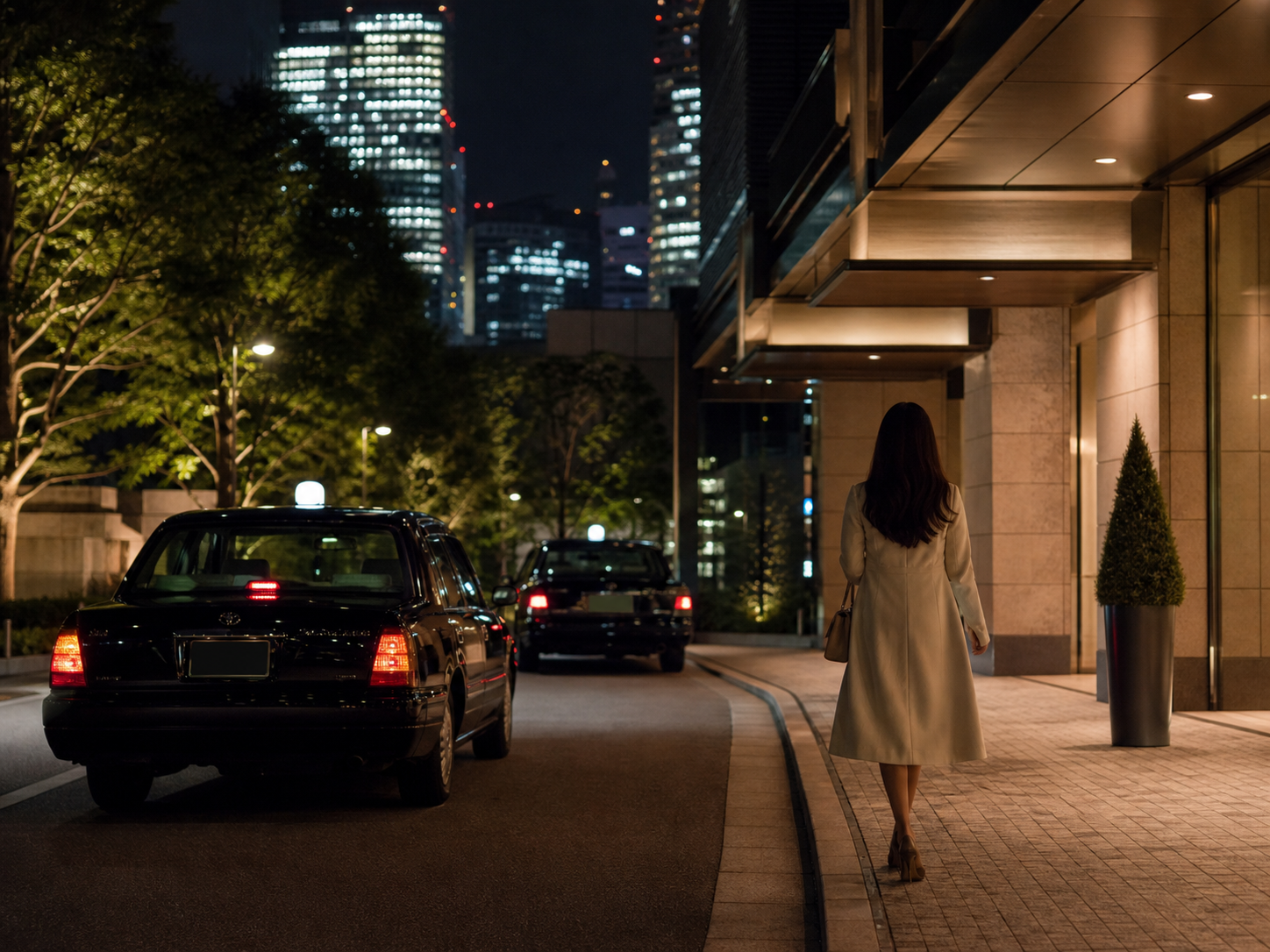 Roppongi Minato Tokyo street at night near a subway entrance, lit signage and quiet pavement—access and discreet arrival context for outcall
