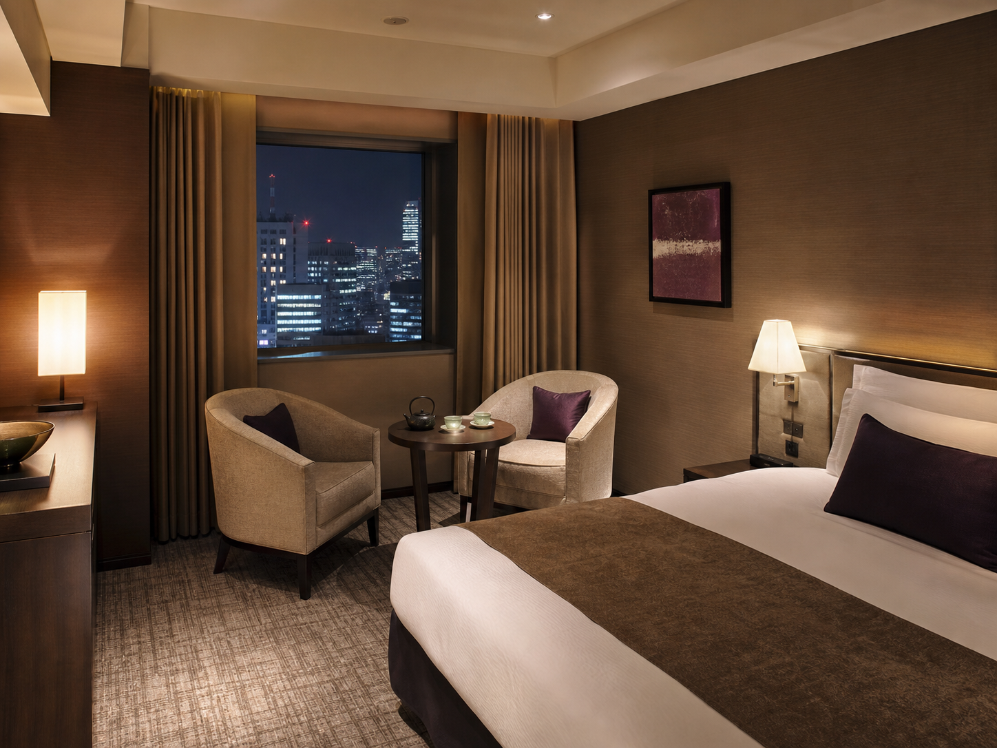 Quiet premium hotel room in central Tokyo at night set for a companion outcall booking, calm evening ambiance