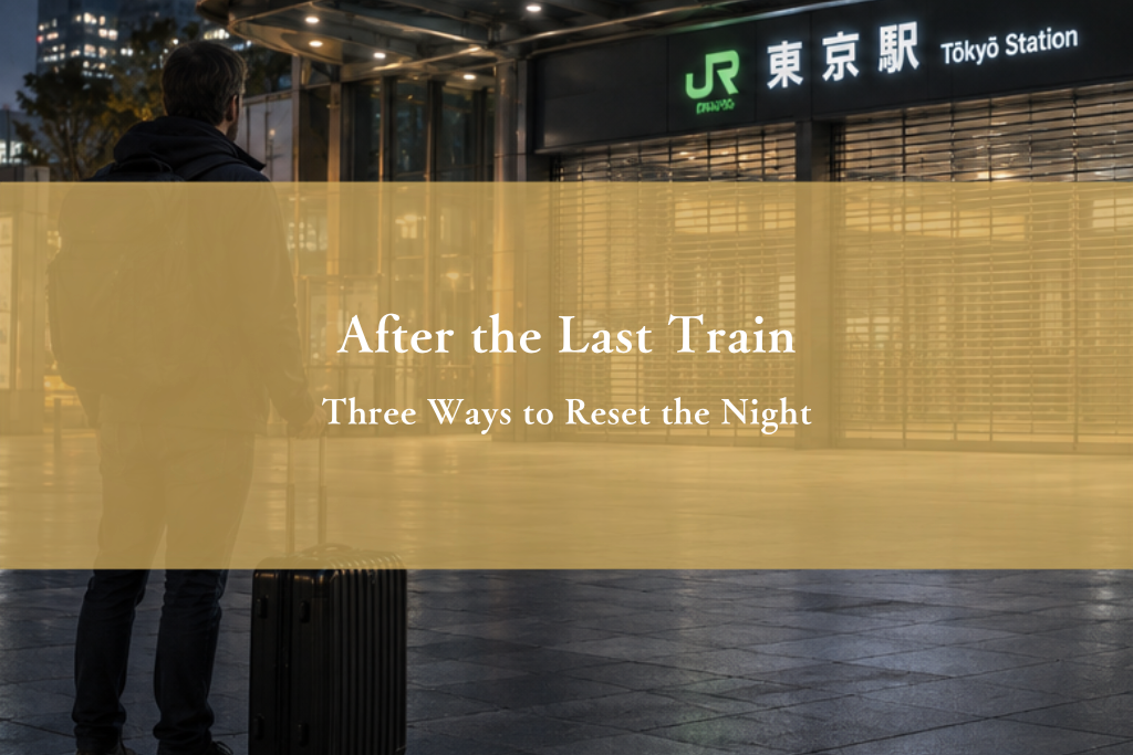Adult solo traveler outside a Tokyo station after the last train, considering the hours before morning