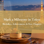 Tokyo skyline at blue hour with a birthday dessert, flowers, and a blank keepsake card